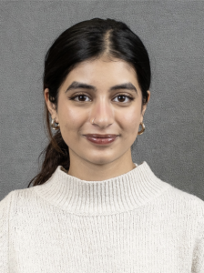A woman smiling lightly. 